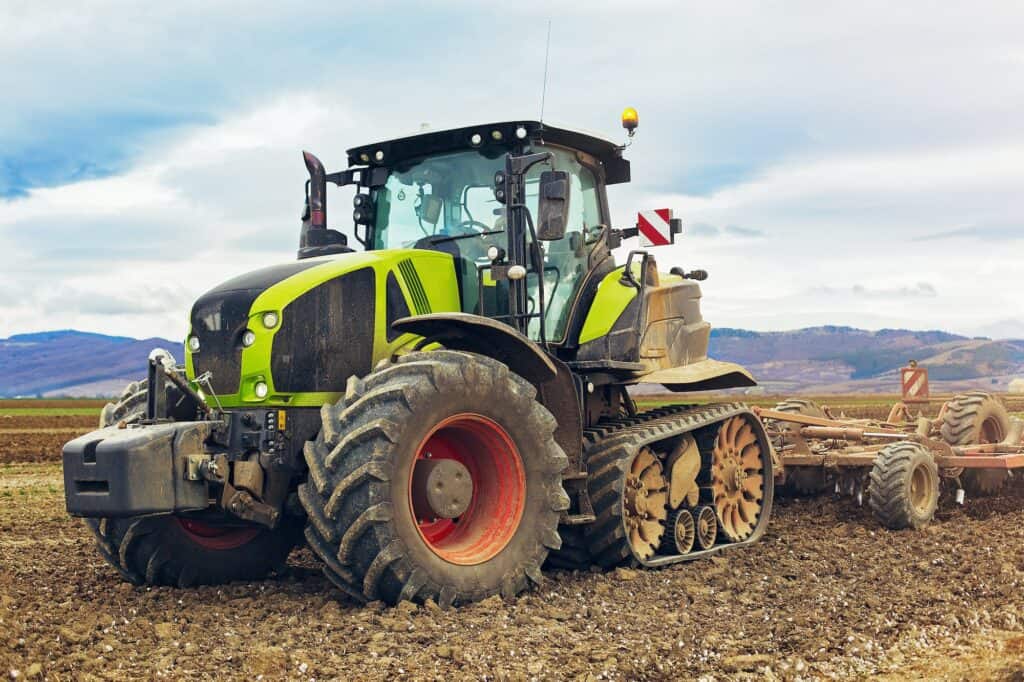 Modern tractor working on the farm, a modern agricultural transport